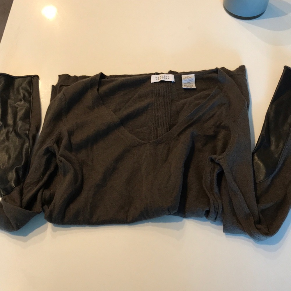 Barney’s dark green sweater with leather trim